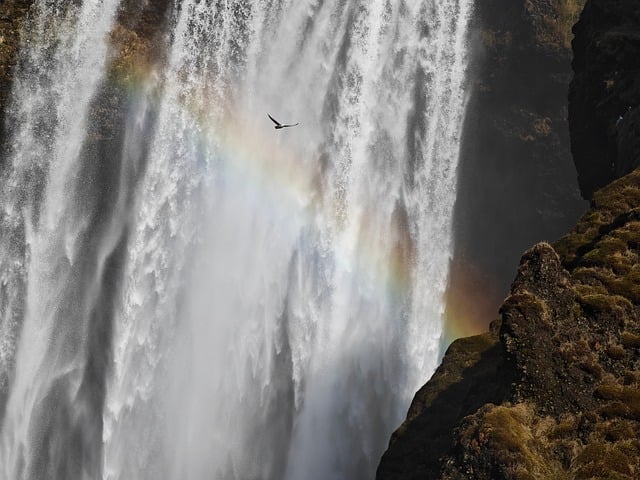 Icelandic waterfall with rainbow